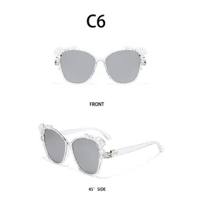 Front and 45-degree side view of transparent sunglasses with floral accents on the frame