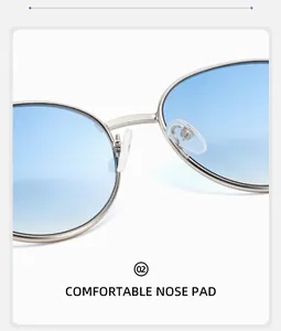 Détail des plaquettes de nez en silicone et de la monture en métal de lunettes rondes