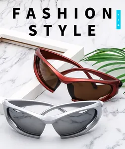 Fashionable wrap-around sports sunglasses in red and silver frames on marble background