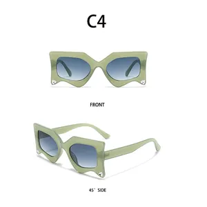 Front and 45-degree side view of sage green rhinestone butterfly sunglasses with blue lenses