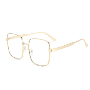 Golden square metal frame sunglasses with elegant diamond texture on temples