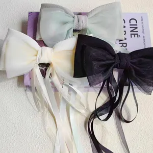 Eleganti fermagli per capelli a fiocco con lunghe nappe in verde, beige e nero