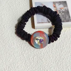 Elegant black pleated scrunchie with colorful beads and a heart crystal charm