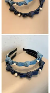 Close-up detail of denim headband with elegant pearl accents and bow knot design