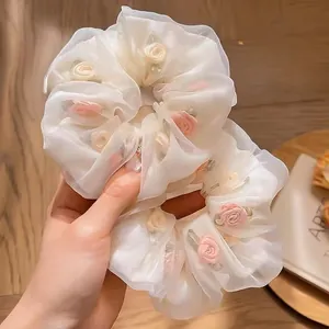 Floral embroidered tulle scrunchies in white organza for elegant ponytail styling