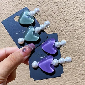 Quattro fermagli per capelli a cuore occhio di gatto con perle in verde e viola