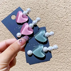 Set di fermagli per capelli a forma di cuore con perle nei colori rosa e ciano