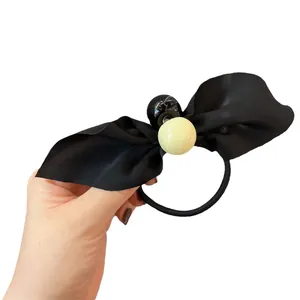 Korean style black chiffon bow hair tie with glossy beads on a high elastic band