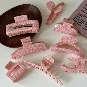 Pink marble acetate hair claw set including butterfly and geometric style clips