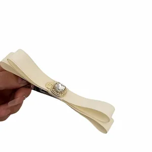 French style cream bow hair clip with luxury crystal centerpiece and satin fabric