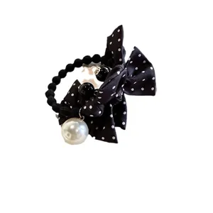 Élastique à cheveux chic avec nœud noir à pois et perles pour femme tendance
