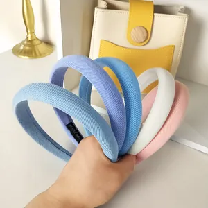 Detailed view of colorful striped fabric headbands with soft sponge padding texture