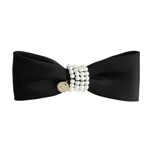Elegant black velvet bow hair clip with white faux pearls and gold handmade tag