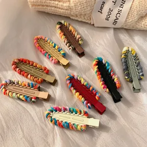 Colorful knitted y2k dopamine style hair clips with matte metal base on soft fabric