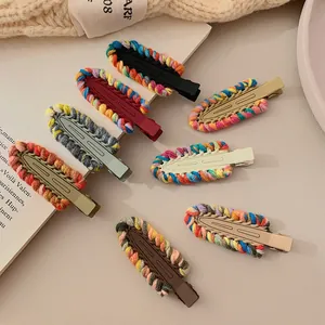 Detail of colorful Y2K crochet knit hair clips in assorted vibrant yarn patterns