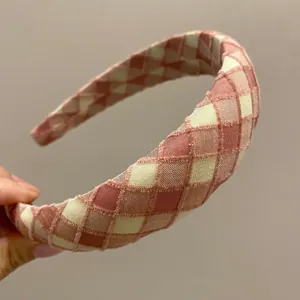 Pink and beige checkered padded headband for women with a high top sponge design