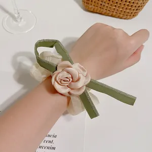 Elegant camellia hair scrunchie with champagne satin rose and light mesh fabric decoration