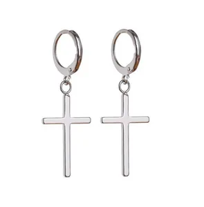 Detailed view of silver stainless steel polished hoop earrings with cross pendants