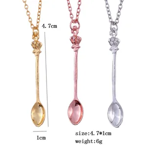 Three crown spoon necklaces in gold, rose gold and silver showing 4.7cm x 1cm dimensions