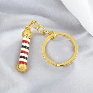 Llavero de poste de barbero retro con espiral rojo blanco azul y metal dorado