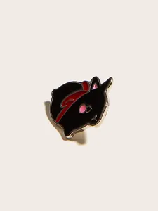 Macro view of cute black enamel rabbit pin with red hat and silver metallic edges