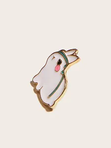 Macro shot of a cute white ghost brooch with gold edges and soft physical shadow