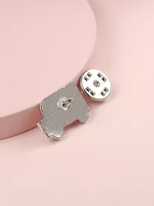Detail of silver ambulance brooch back showing sturdy safety pin and metal clutch clasp