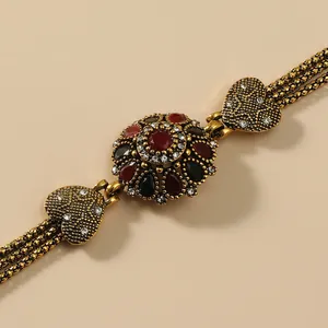 Vintage Armband mit Gold-Finish und roten und schwarzen Kristall-Edelsteinen im Retro-Stil