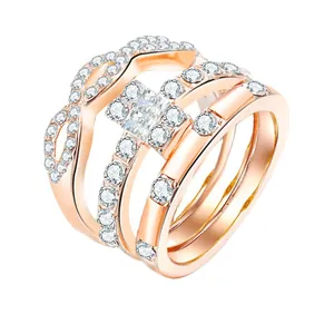 Three-piece stackable rose gold ring set featuring princess cut cubic zirconia stones