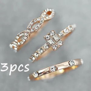 Three-piece rose gold ring set featuring sparkling zircon stones and infinity designs