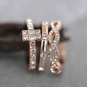 Three-piece rose gold ring set with sparkling zircon stones in a stylish geometric design