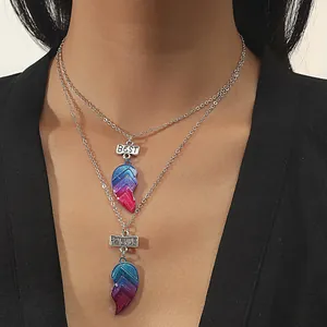 Matching Best Friends heart pendants with colorful galaxy gradient on silver-tone necklaces