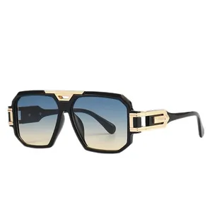 Oversized square fashion sunglasses with black gold frame and blue-yellow gradient lenses