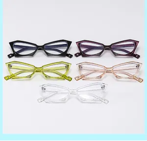 Detail of five bold cat eye glasses frames in black, yellow, pink, and clear colors