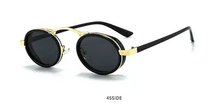 Vue détaillée à 45 degrés de lunettes de soleil ovales steampunk avec verres noirs et métal doré