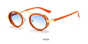 Détail des lunettes steampunk ovales avec monture orange et pont en métal doré