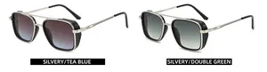 Close-up of double bridge metal sunglasses with tea blue and green gradient lenses