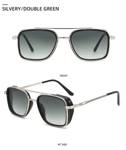 Close-up of silvery metal sunglasses with green gradient lenses and side mesh detailing