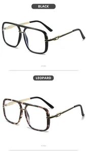 Detail view of large frame sunglasses in black and leopard print with gold metal accents