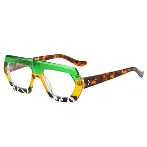 Oversize geometric sunglasses with green, yellow, and spotted frame on white background