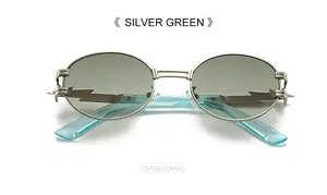 Macro detail of silver metal oval sunglasses with lightning decor and green lenses