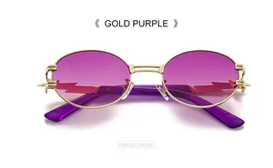 Close-up of gold metal sunglasses with purple gradient lenses and lightning edge cut