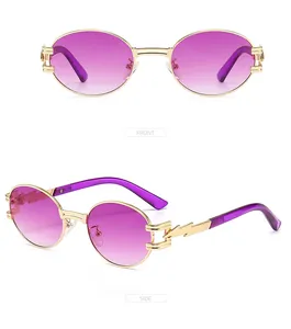 Detail of vintage round sunglasses with gold lightning temples and purple gradient lenses