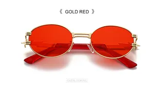 Top view of gold metal oval sunglasses with red lenses and unique lightning side cut