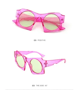 Close-up of geometric C5 sunglasses with pink transparent frames and light green lenses