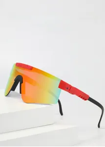 Macro detail of polarized sport sunglasses showing UV400 lens and red speckled frame