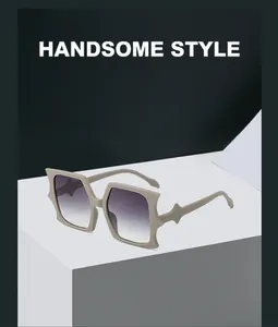 Macro shot of oversized bat-shaped sunglasses with beige frames and purple gradient lenses