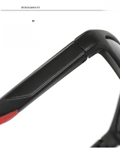 Detailed macro view of the matte black square sunglass hinge with red accent design