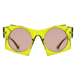 Modern avant-garde sunglasses with translucent yellow geometric frame and pink lenses