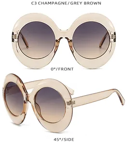 Detailed front and side views of champagne oval oversized sunglasses with gradient lenses